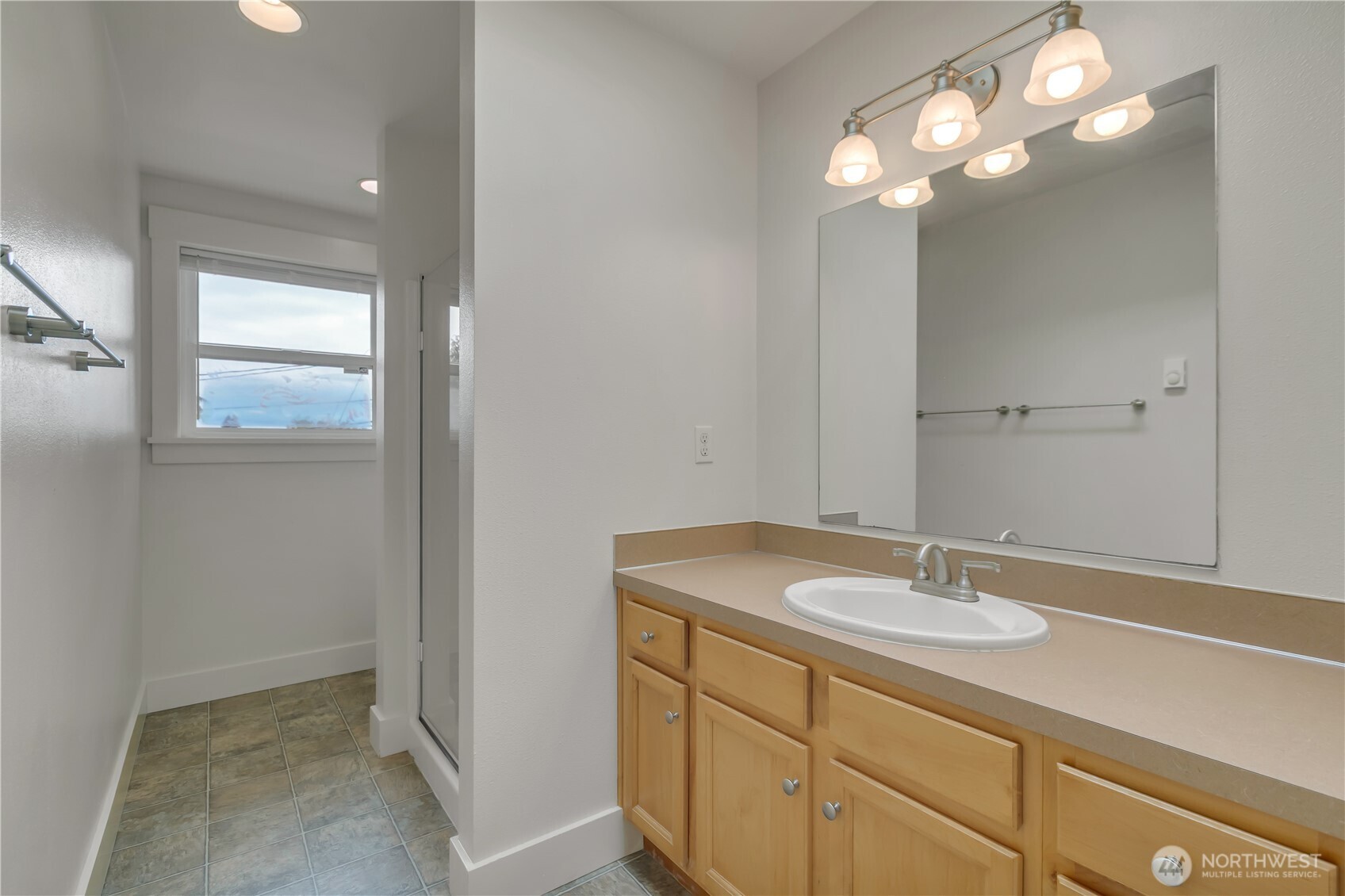 4945 North Pearl Street Ruston, WA 98407 - Photo 17 of 22 a bathroom with a sink and a mirror