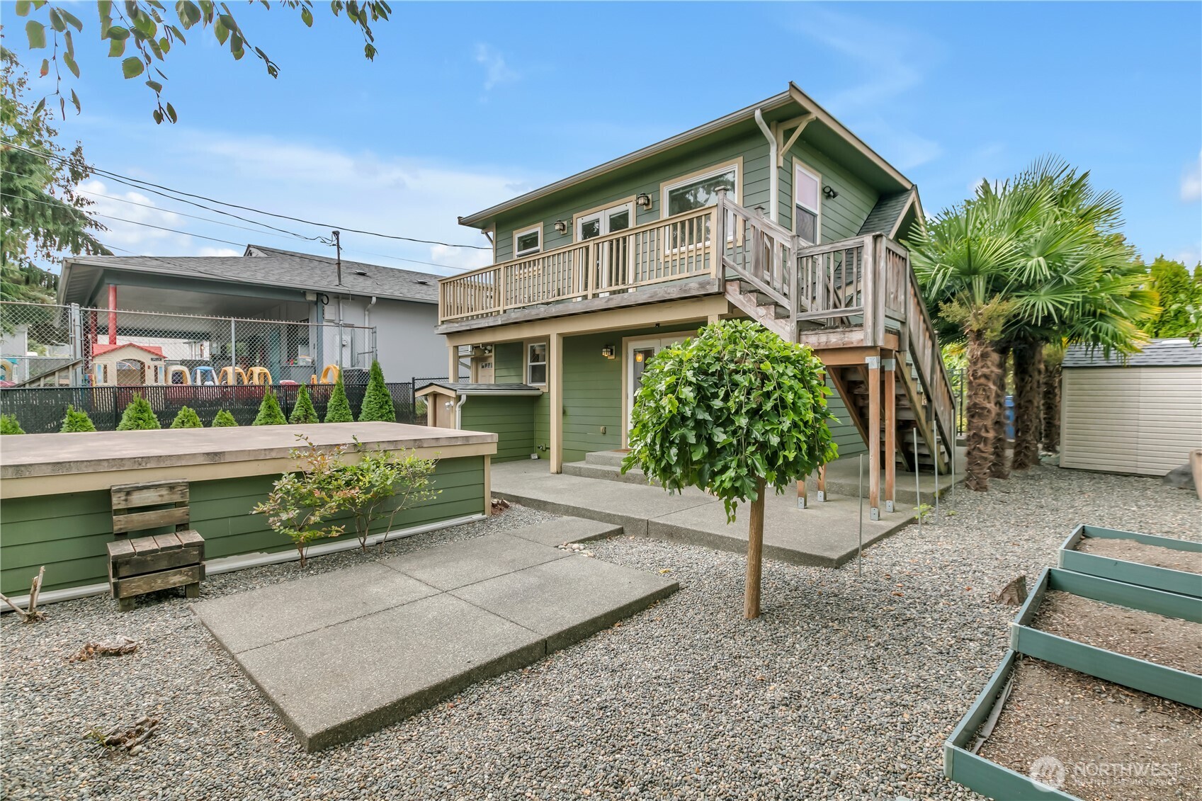 4945 North Pearl Street Ruston, WA 98407 - Photo 19 of 22 a front view of a house with a garden