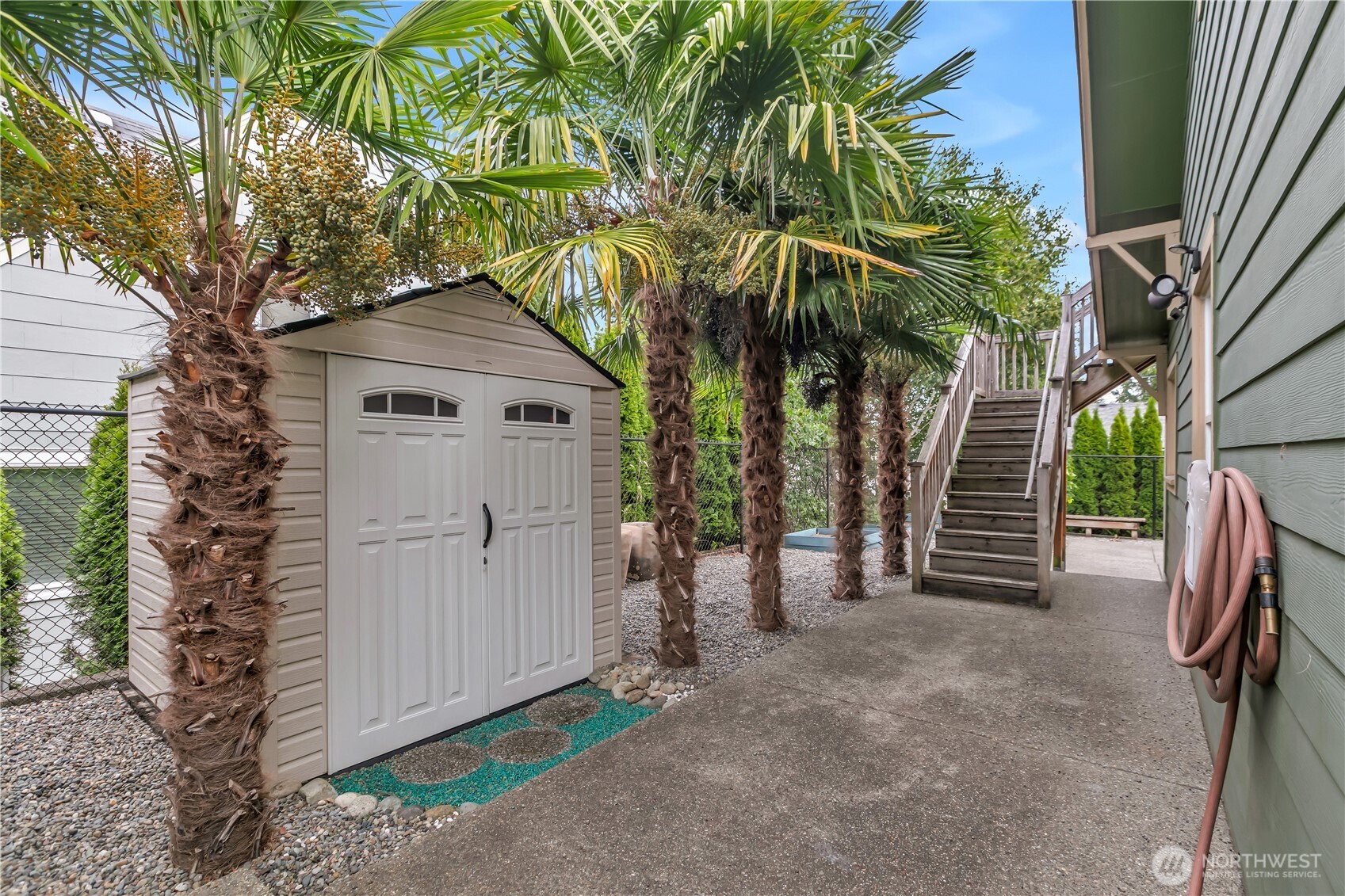 4945 North Pearl Street Ruston, WA 98407 - Photo 22 of 22 a view of a house with a yard and garage