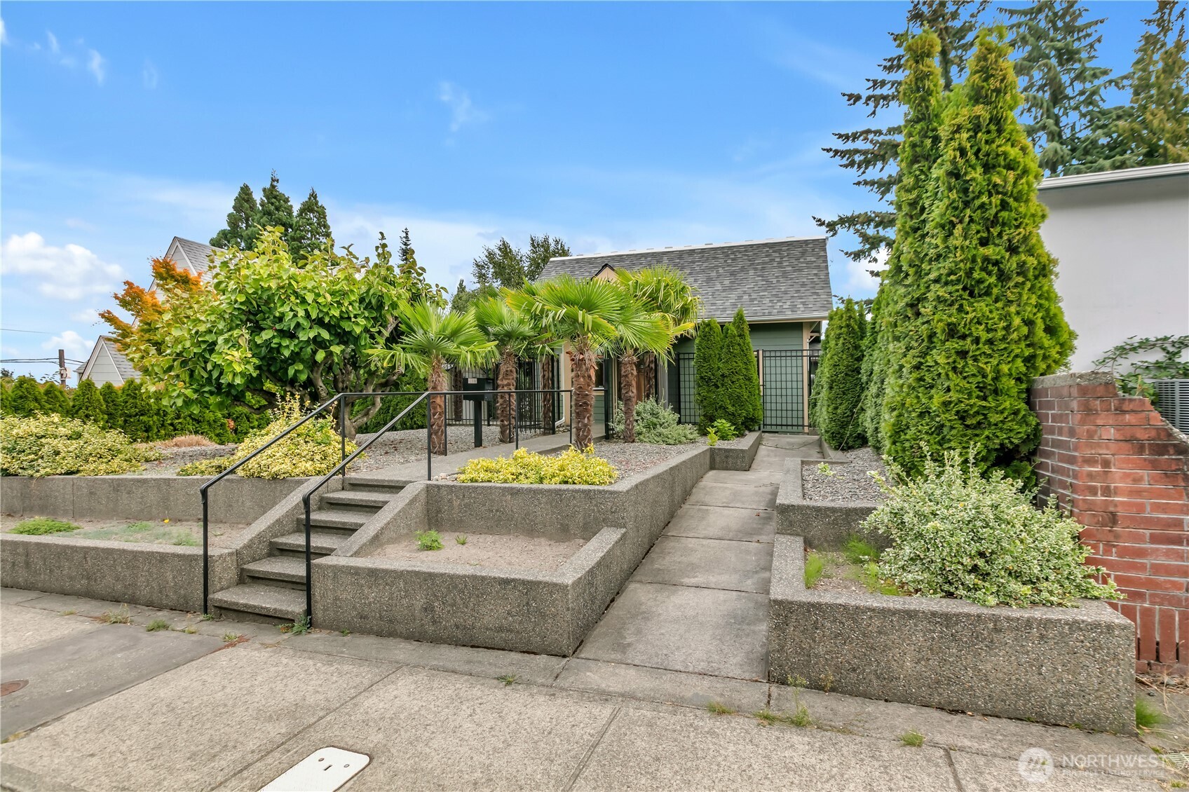 4945 North Pearl Street Ruston, WA 98407 - Photo 3 of 22 a view of a swimming pool with a patio