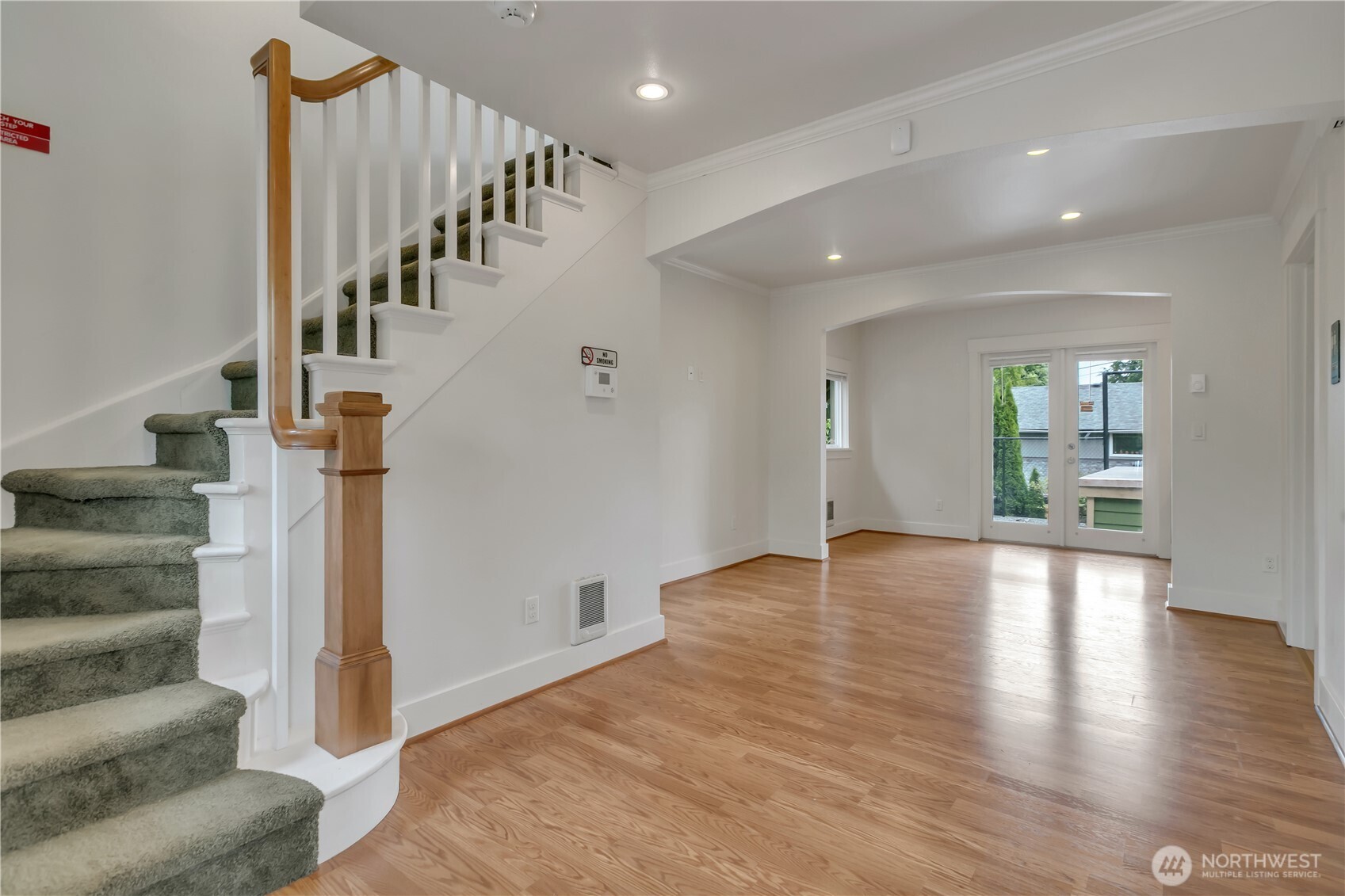 4945 North Pearl Street Ruston, WA 98407 - Photo 4 of 22 a view of an entryway with wooden floor and a living room