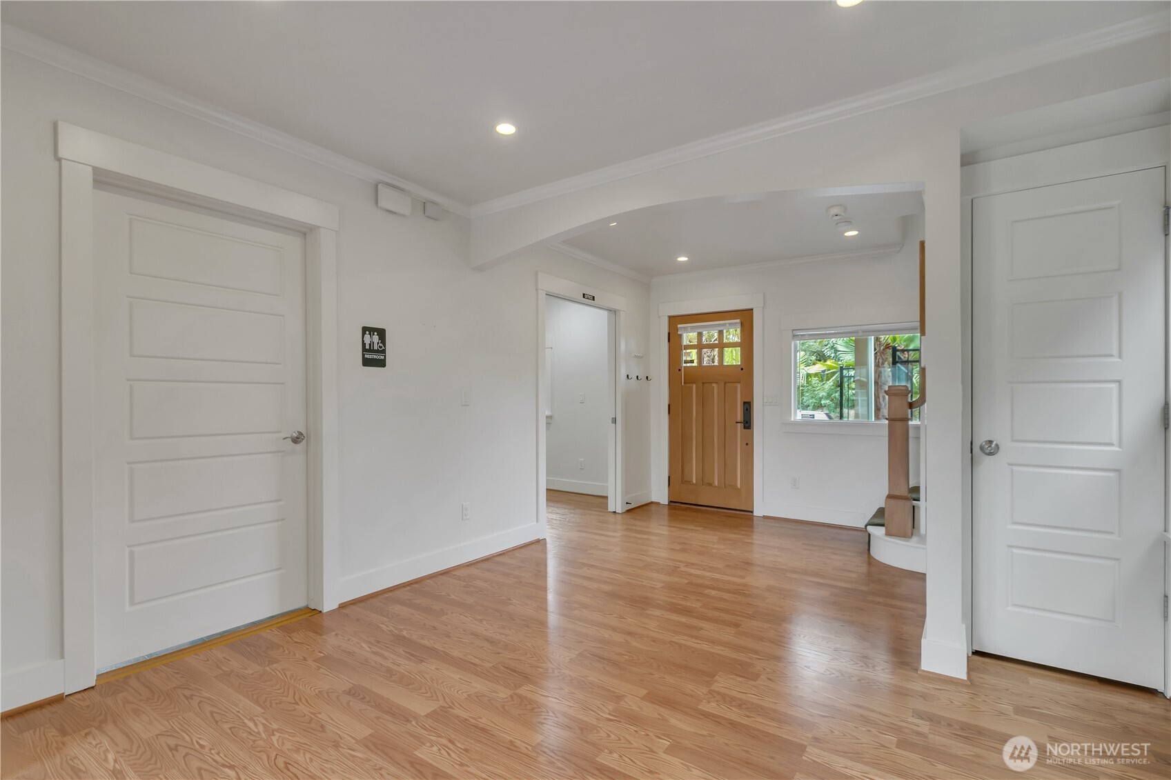 4945 North Pearl Street Ruston, WA 98407 - Photo 5 of 22 an empty room with wooden floor & windows