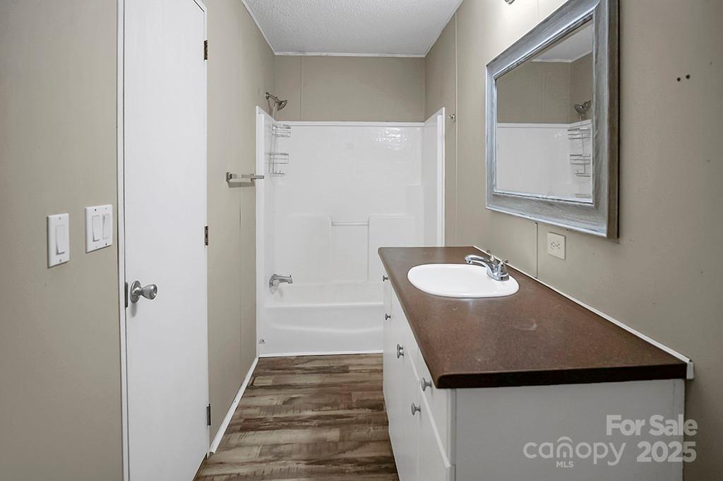 203 Bethlehem Church Road Grover, NC 28073 - Photo 18 of 34 a bathroom with a granite countertop sink and a mirror
