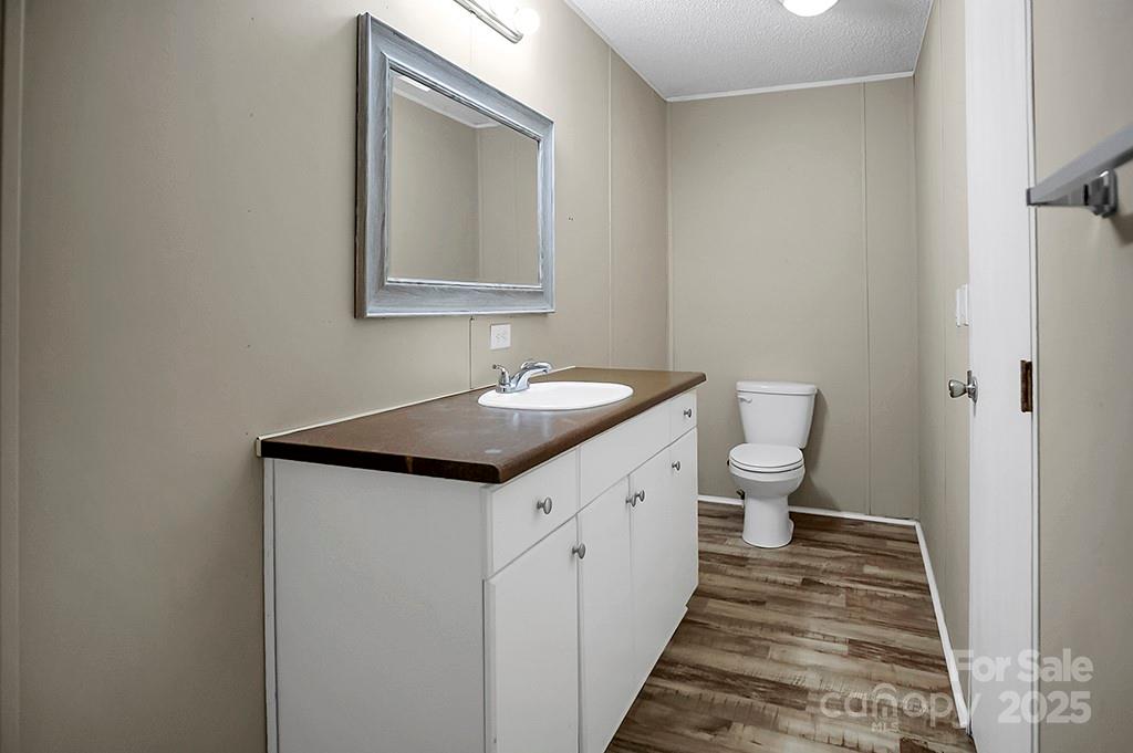 203 Bethlehem Church Road Grover, NC 28073 - Photo 19 of 34 a bathroom with a granite countertop sink and a mirror