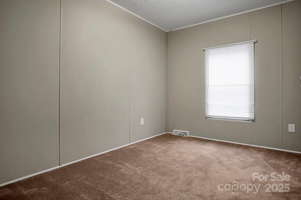 203 Bethlehem Church Road Grover, NC 28073 - Photo 20 of 34 a view of an empty room with a window