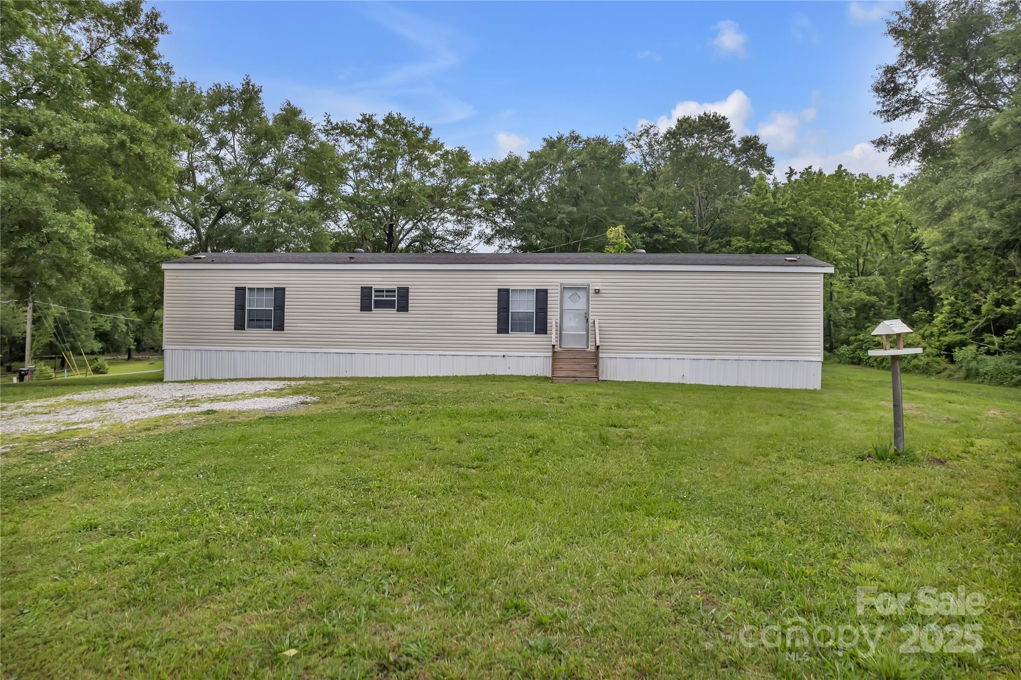 203 Bethlehem Church Road Grover, NC 28073 - Photo 2 of 34 a view of a house with a backyard