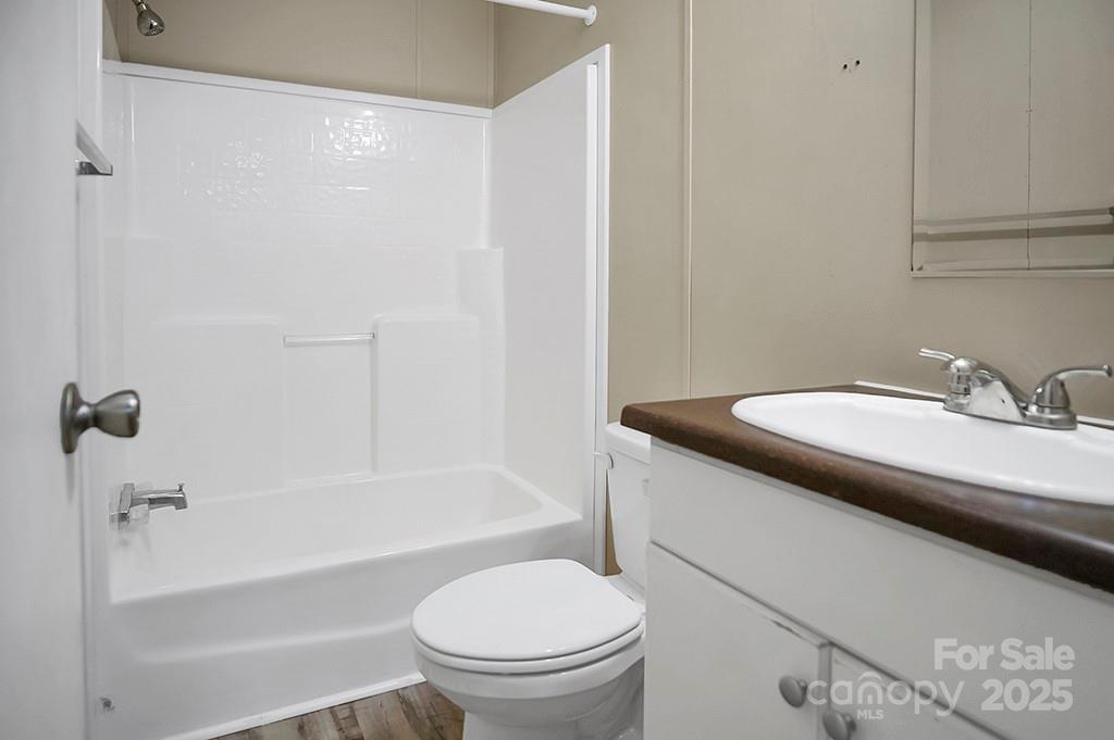 203 Bethlehem Church Road Grover, NC 28073 - Photo 21 of 34 a bathroom with a granite countertop sink toilet and shower