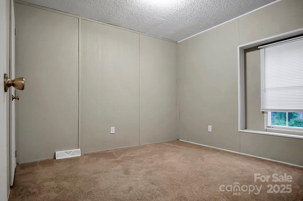 203 Bethlehem Church Road Grover, NC 28073 - Photo 23 of 34 a view of an empty room with a window