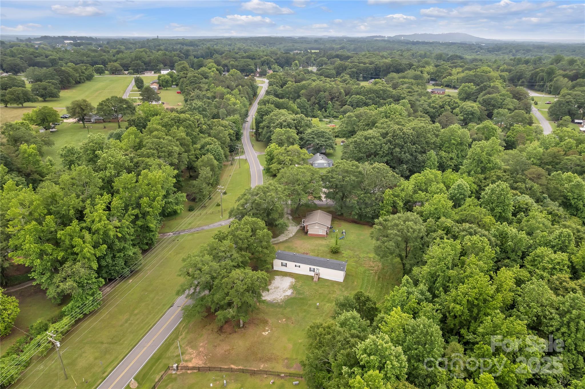 203 Bethlehem Church Road Grover, NC 28073 - Photo 31 of 34 a view of a forest with a street