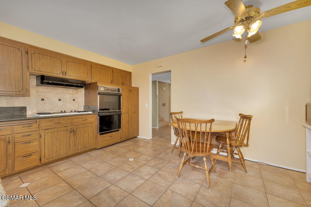 1300 Rachel Drive Oxnard, CA 93030 - Photo 12 of 50 a kitchen with granite countertop cabinets and chairs