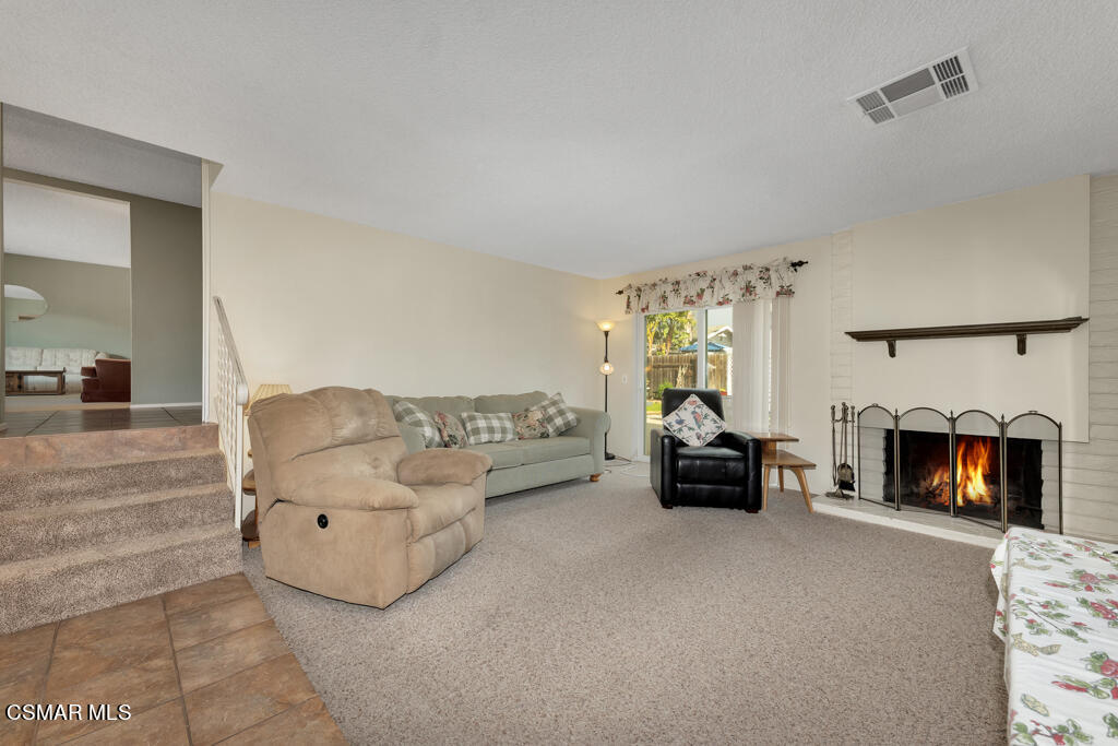 1300 Rachel Drive Oxnard, CA 93030 - Photo 15 of 50 a living room with furniture and a fireplace