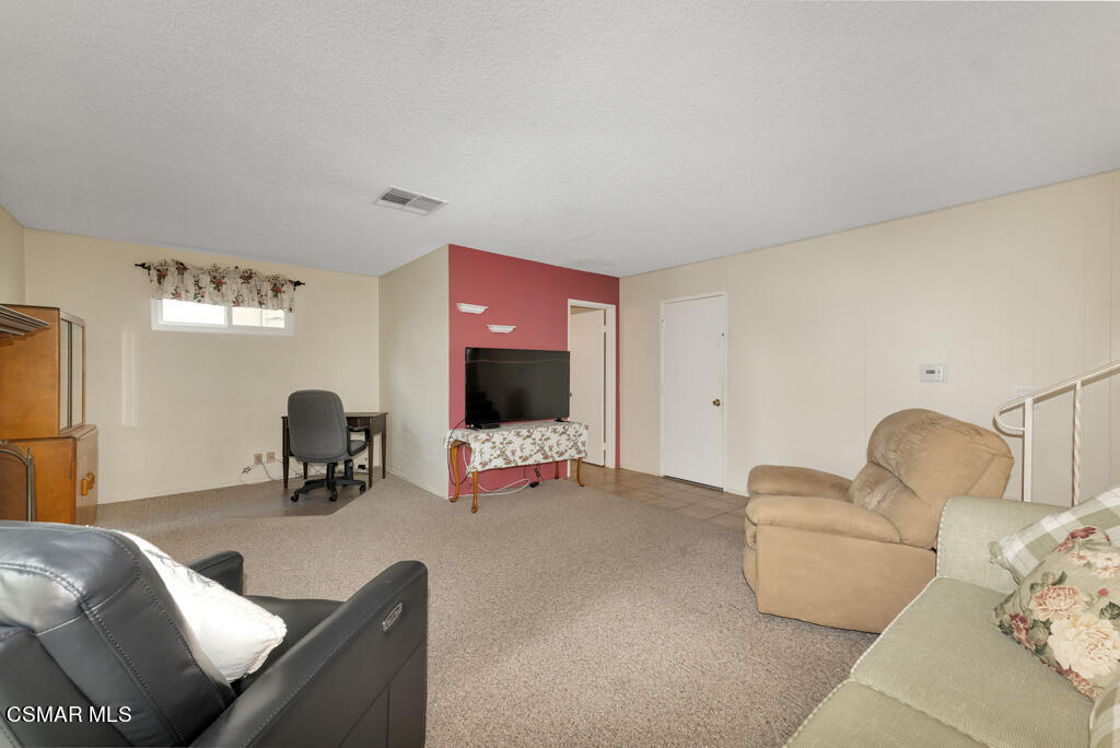 1300 Rachel Drive Oxnard, CA 93030 - Photo 17 of 50 a living room with furniture and a flat screen tv