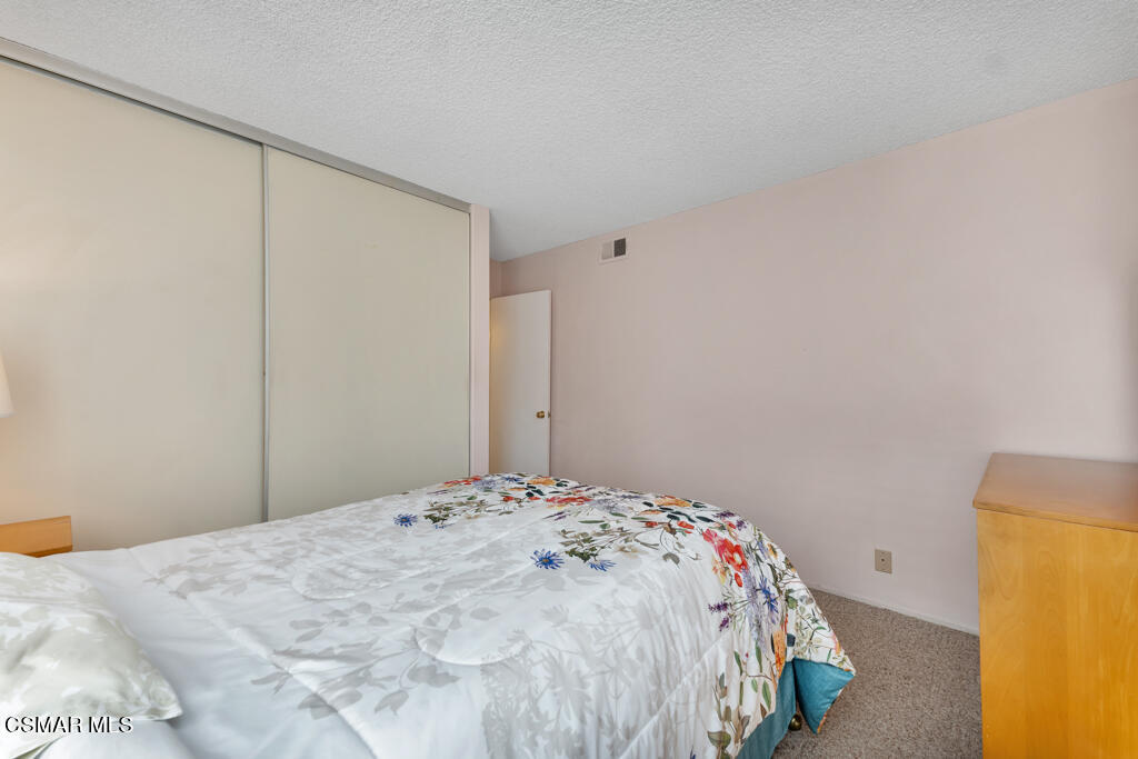 1300 Rachel Drive Oxnard, CA 93030 - Photo 26 of 50 a bedroom with a bed and a wall painting
