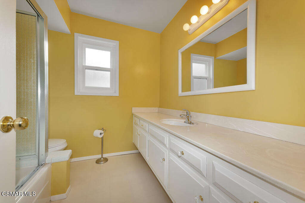 1300 Rachel Drive Oxnard, CA 93030 - Photo 27 of 50 a bathroom with a granite countertop sink mirror and a bathtub