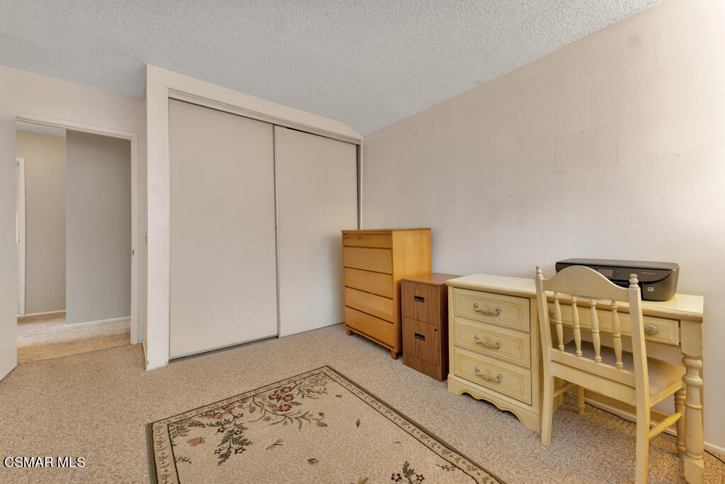 1300 Rachel Drive Oxnard, CA 93030 - Photo 29 of 50 a bedroom with a bed and cabinets