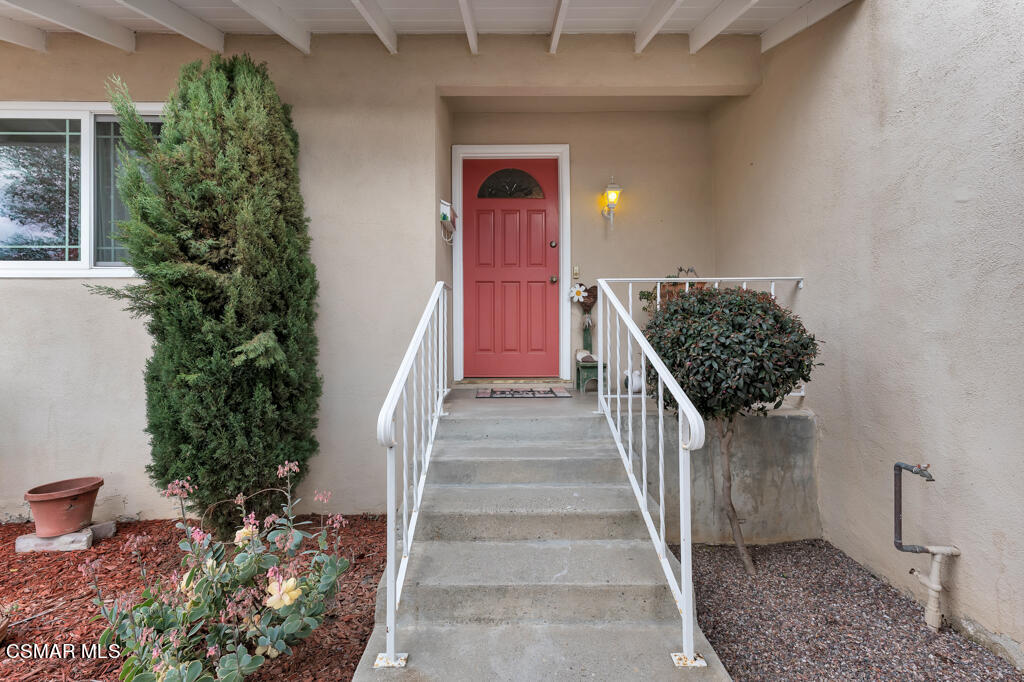 1300 Rachel Drive Oxnard, CA 93030 - Photo 38 of 50 a view of a hallway with wooden walls and potted plants