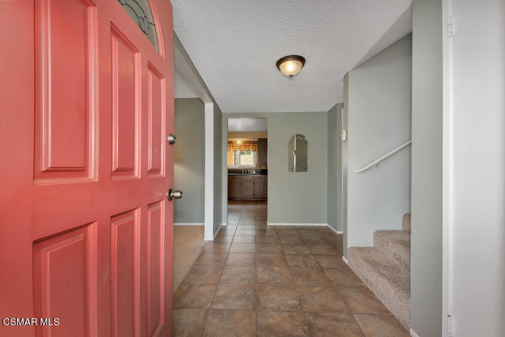 1300 Rachel Drive Oxnard, CA 93030 - Photo 4 of 50 a view of a hallway with wooden shelves