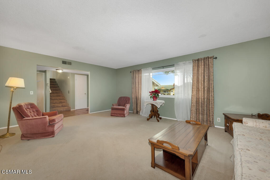 1300 Rachel Drive Oxnard, CA 93030 - Photo 7 of 50 a living room with furniture and a mirror