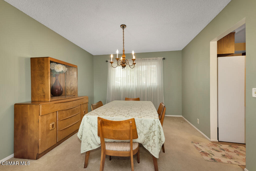 1300 Rachel Drive Oxnard, CA 93030 - Photo 9 of 50 a bed room with a bed and a chandelier