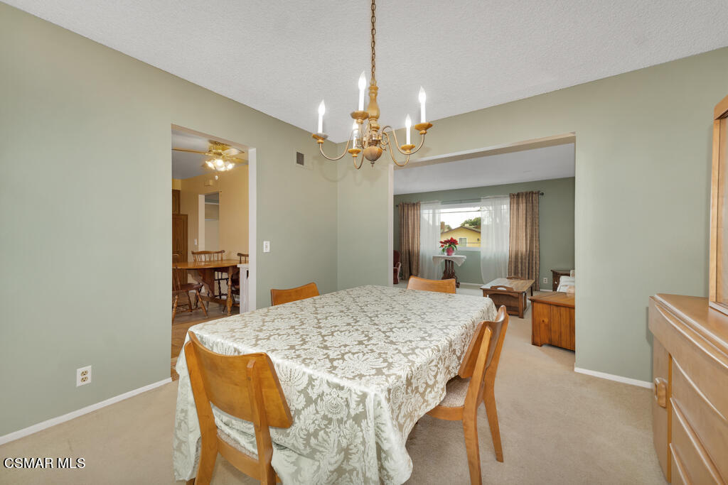 1300 Rachel Drive Oxnard, CA 93030 - Photo 10 of 50 a dining room with a table and chairs