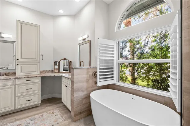 a bedroom with a bed a desk and chair