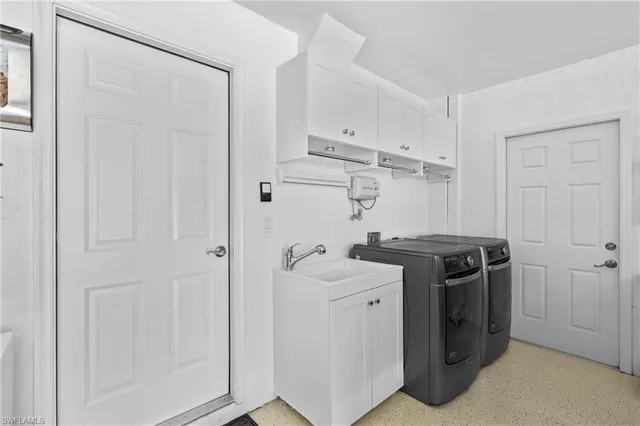 a living room with patio furniture and a floor to ceiling window