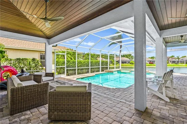 a view of a swimming pool with a patio