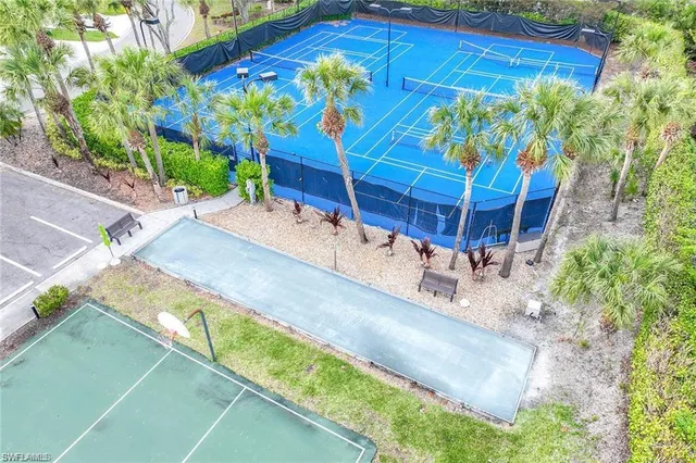 a front view of a house with a yard and potted plant