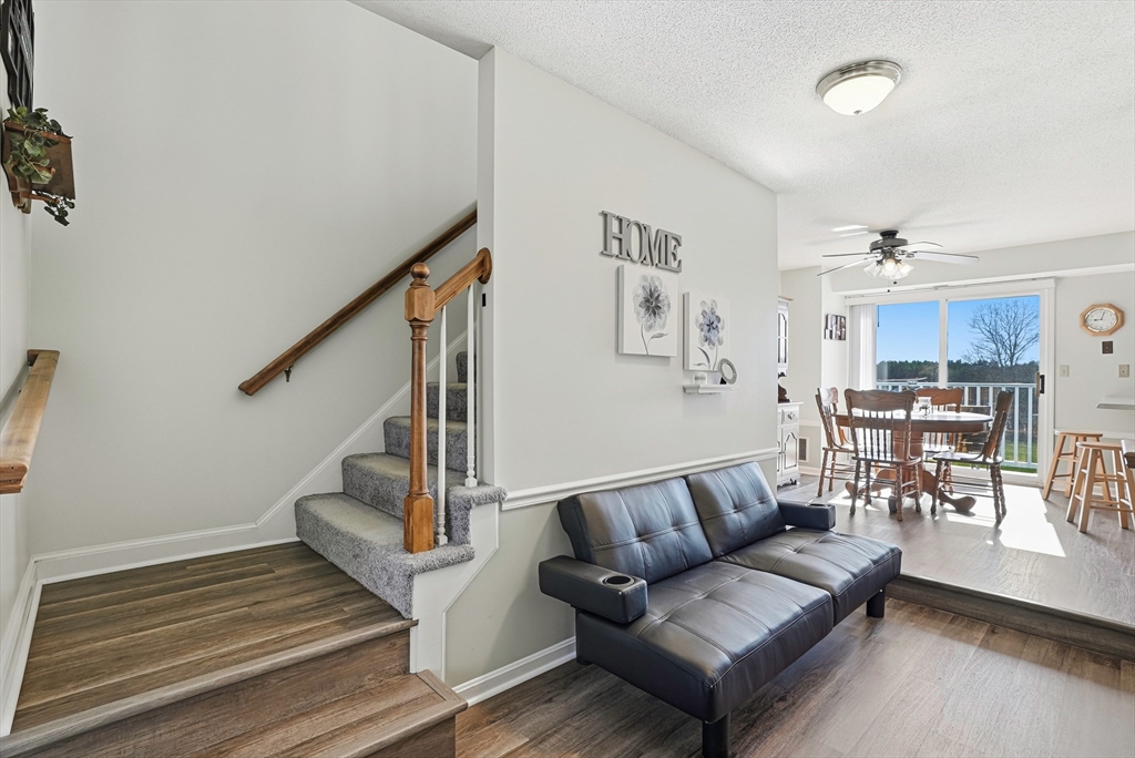 96 Century Way, Unit 96 Gardner, MA 01440 - Photo 16 of 41 a living room with furniture and a wooden floor