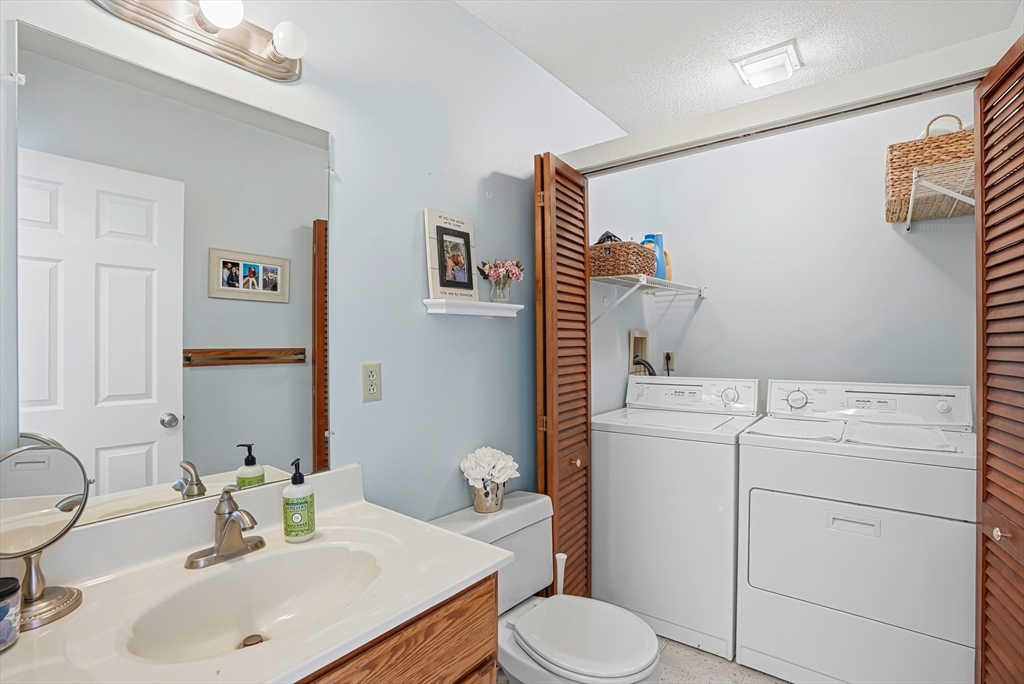 96 Century Way, Unit 96 Gardner, MA 01440 - Photo 17 of 41 a bathroom with a sink toilet and vanity