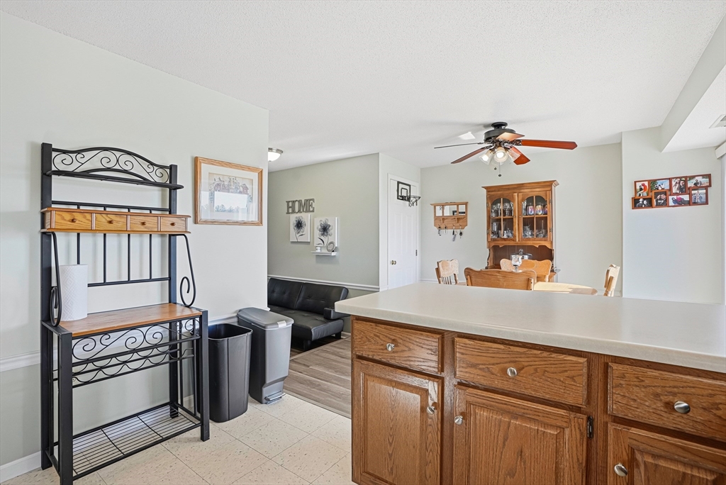 96 Century Way, Unit 96 Gardner, MA 01440 - Photo 23 of 41 a view of a kitchen with fridge and workspace