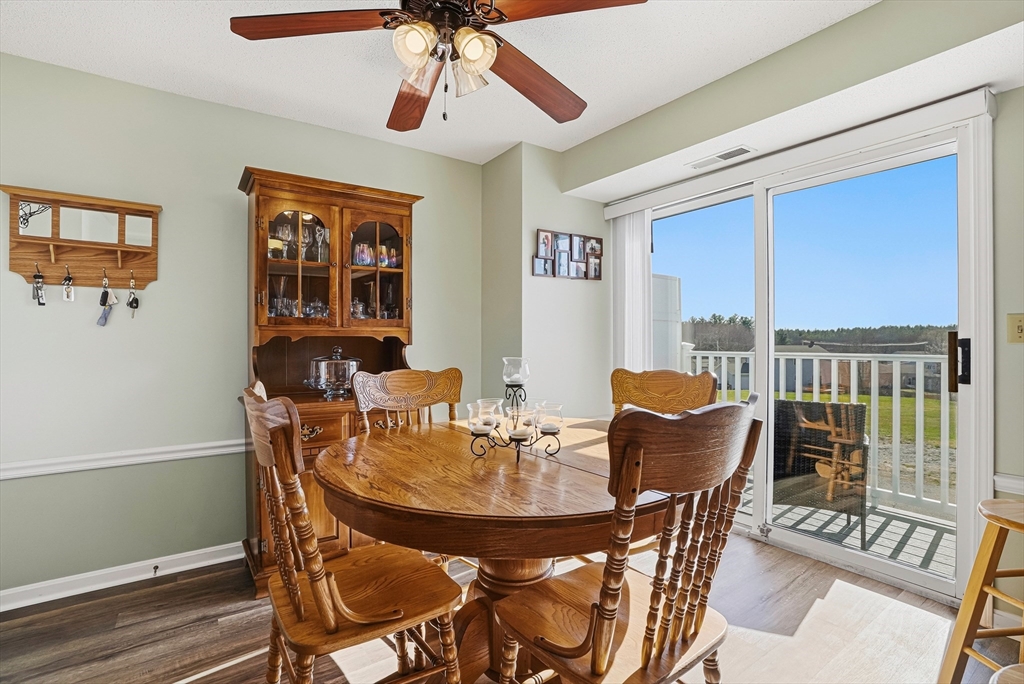 96 Century Way, Unit 96 Gardner, MA 01440 - Photo 26 of 41 a view of a dining room with furniture window and outside view