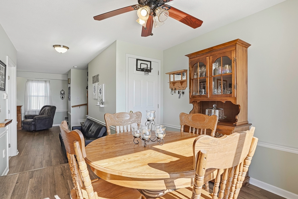 96 Century Way, Unit 96 Gardner, MA 01440 - Photo 29 of 41 a view of a dining room with furniture and wooden floor