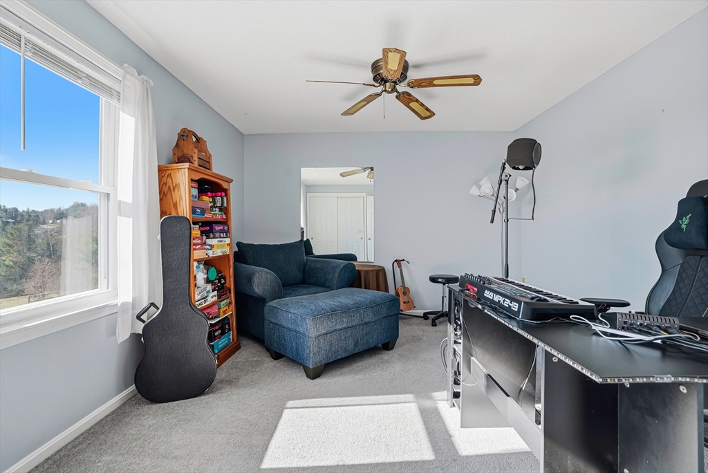 96 Century Way, Unit 96 Gardner, MA 01440 - Photo 38 of 41 a living room with furniture and a window