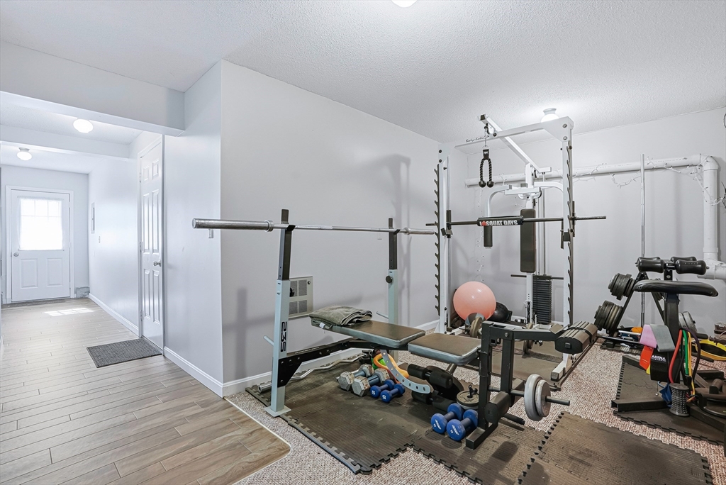 96 Century Way, Unit 96 Gardner, MA 01440 - Photo 5 of 41 a view of a room with gym equipment