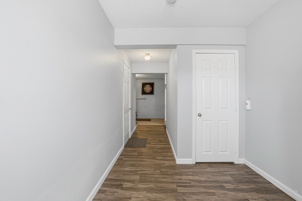 96 Century Way, Unit 96 Gardner, MA 01440 - Photo 7 of 41 a view of a hallway with wooden floor