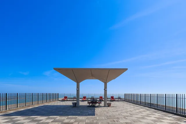 a view of a terrace with a table and chairs