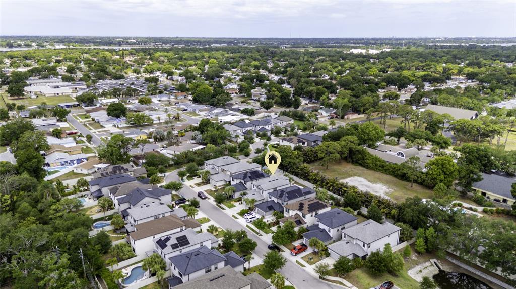8903 Arabella Lane Seminole, FL 33777 - Photo 41 of 47 an aerial view of residential houses with outdoor space and trees