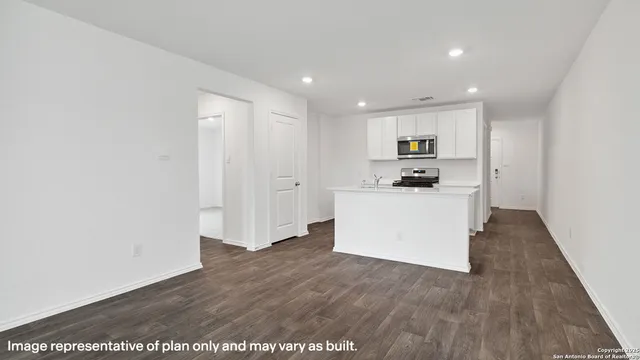 a view of kitchen with wooden floor