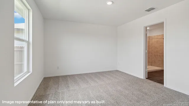 a view of an empty room and window