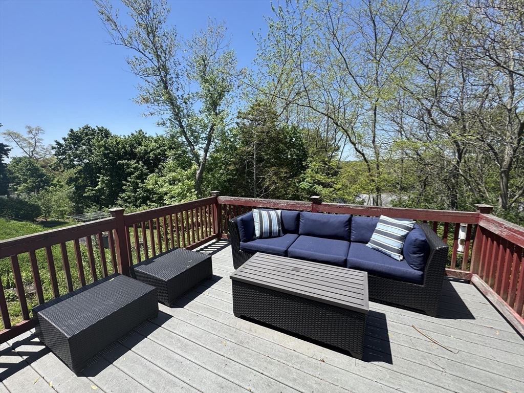 38 Crescent Road, Unit 38 Needham, MA 02494 - Photo 22 of 23 a view of a wooden deck with furniture