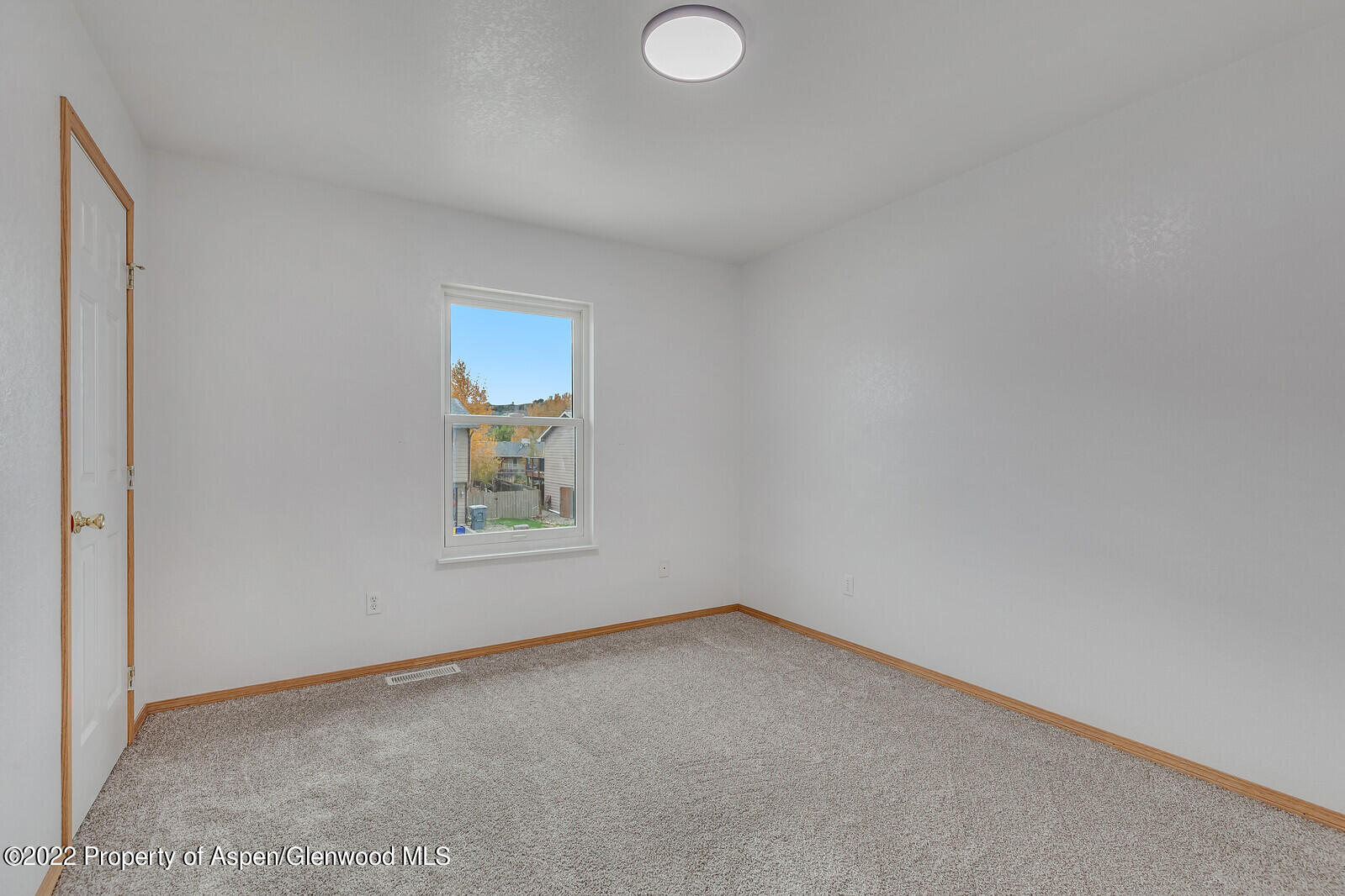2447 Meadow Circle Rifle, CO 81650 - Photo 13 of 36 an empty room with a window
