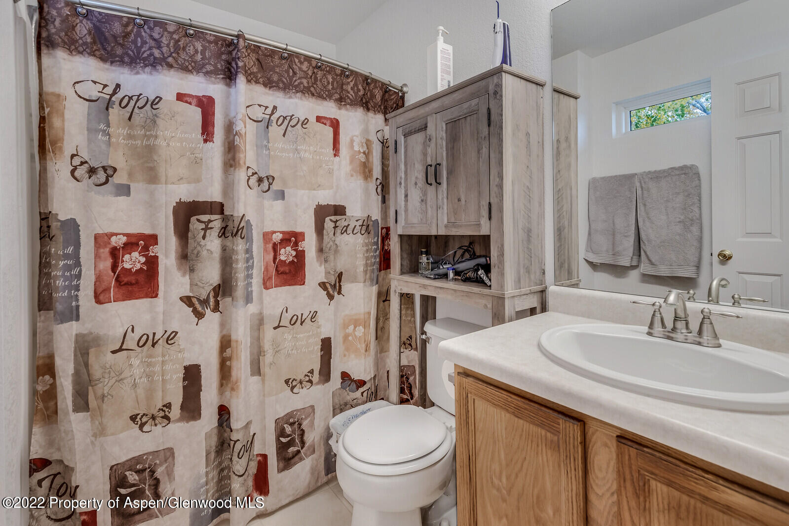 2447 Meadow Circle Rifle, CO 81650 - Photo 18 of 36 a bathroom with a sink toilet and shower