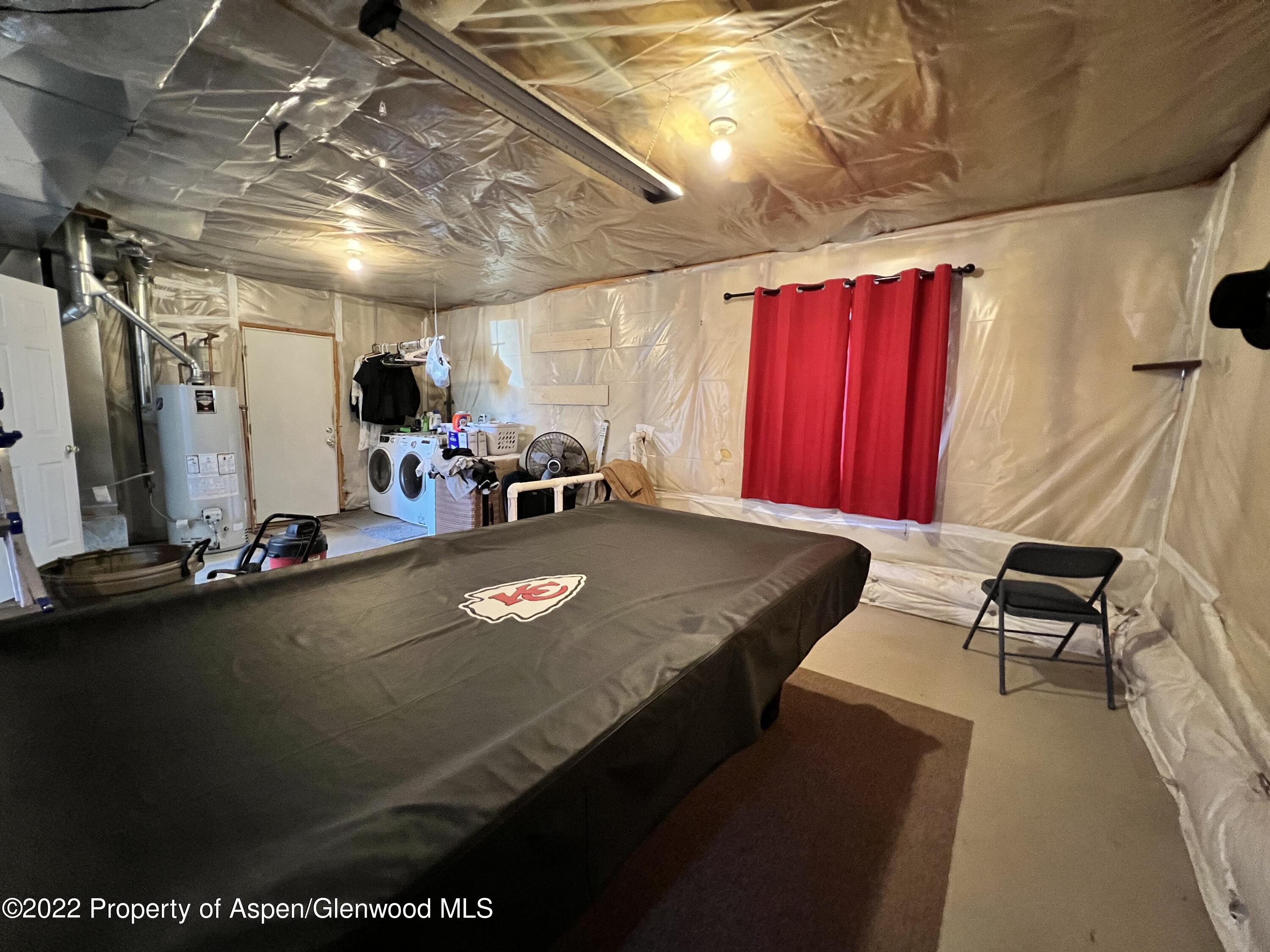 2447 Meadow Circle Rifle, CO 81650 - Photo 23 of 36 a view of a room with gym equipment