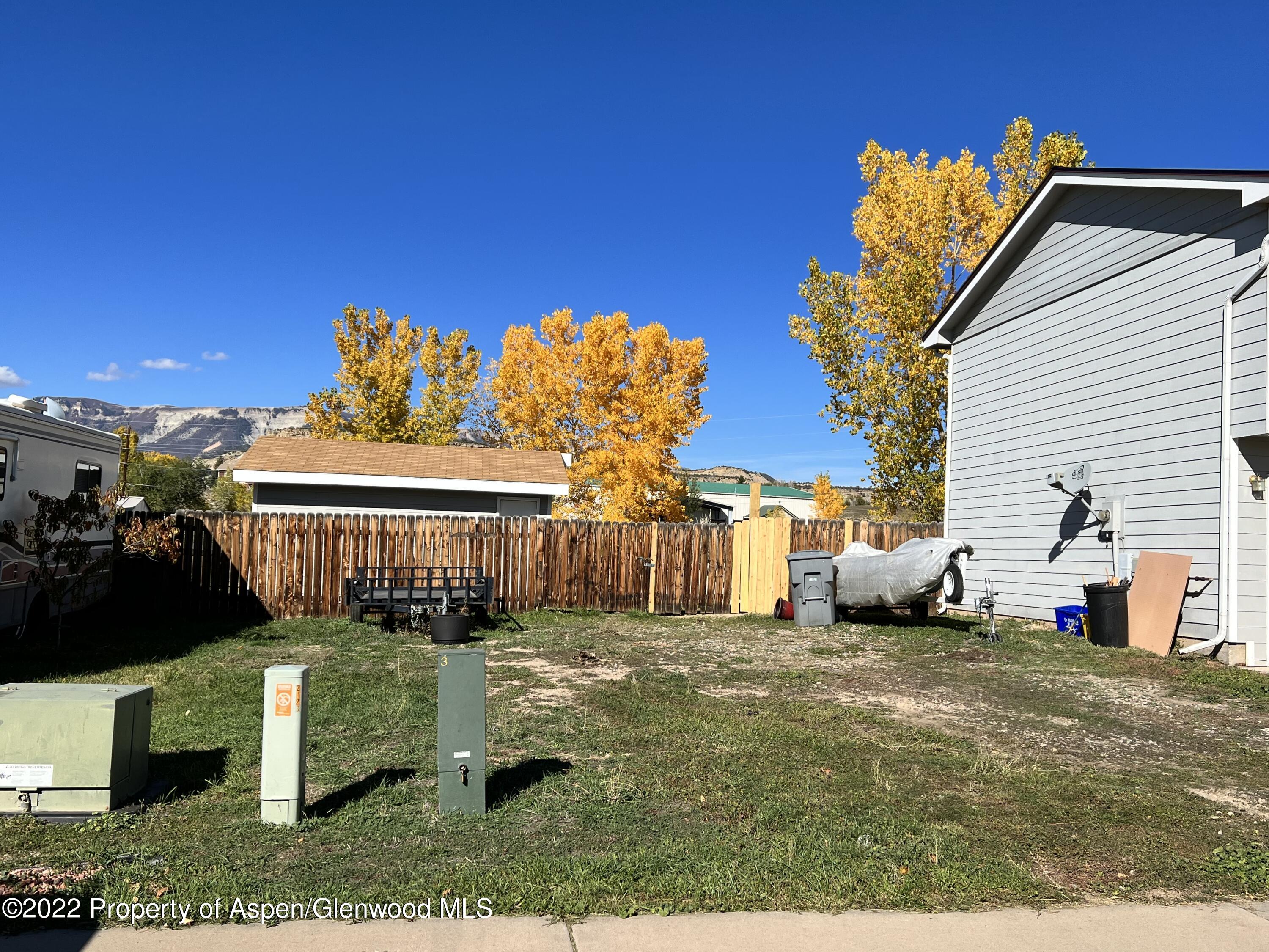 2447 Meadow Circle Rifle, CO 81650 - Photo 31 of 36 a view of a house with a yard