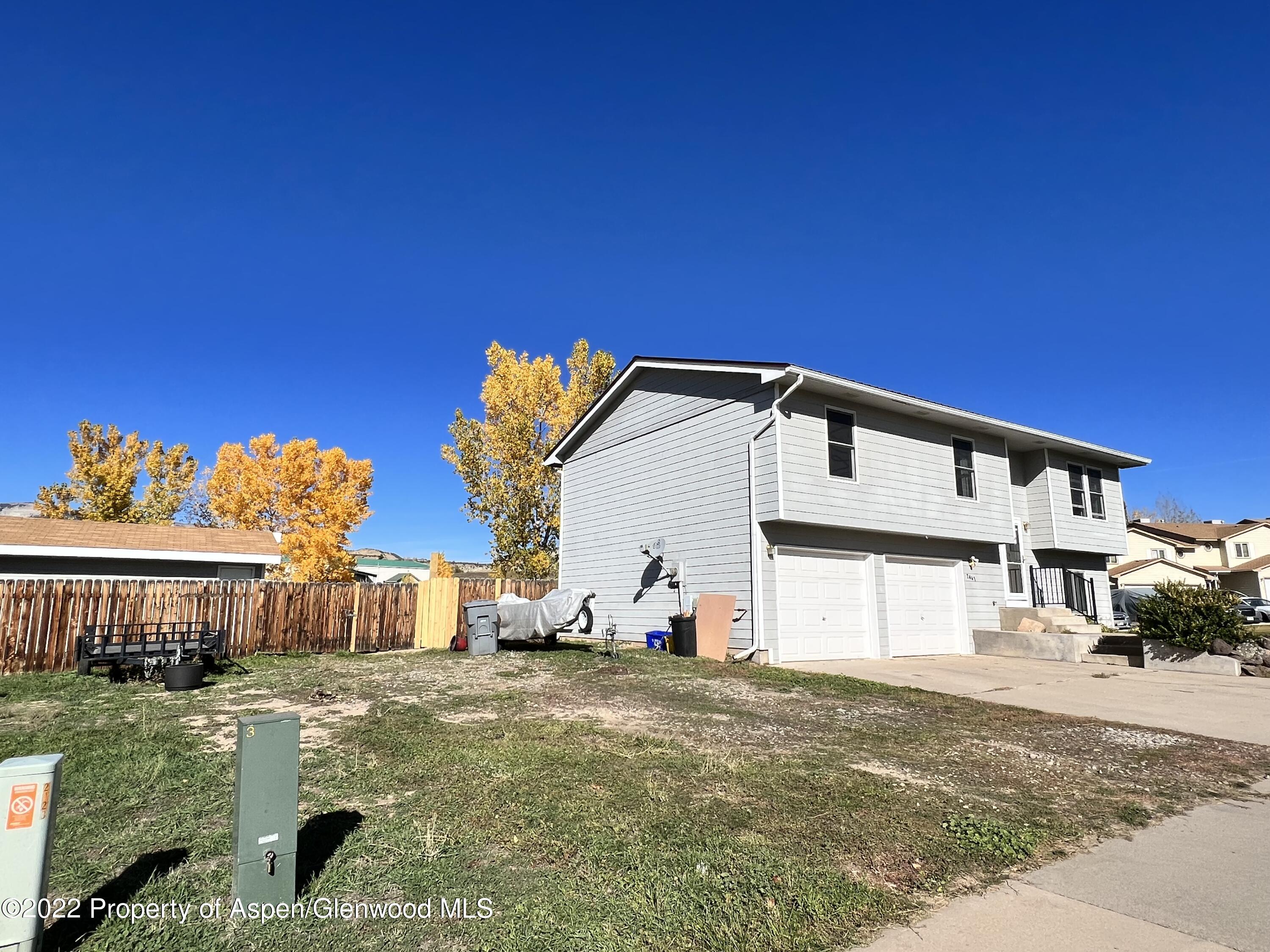 2447 Meadow Circle Rifle, CO 81650 - Photo 32 of 36 a front view of a house with a yard