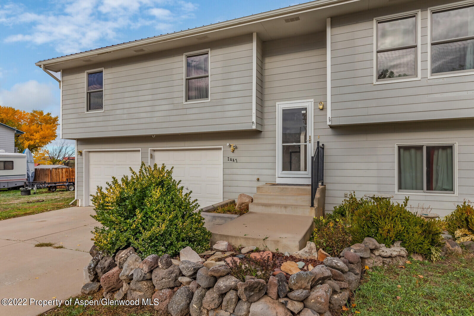 2447 Meadow Circle Rifle, CO 81650 - Photo 35 of 36 a front view of a house with garden