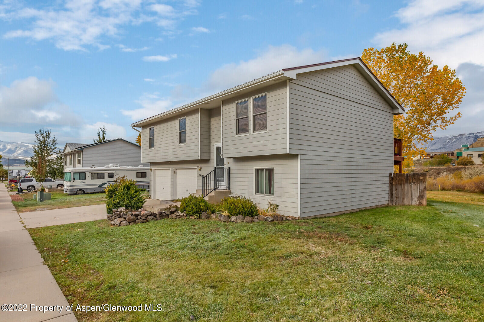2447 Meadow Circle Rifle, CO 81650 - Photo 36 of 36 a view of a house with backyard and sitting area