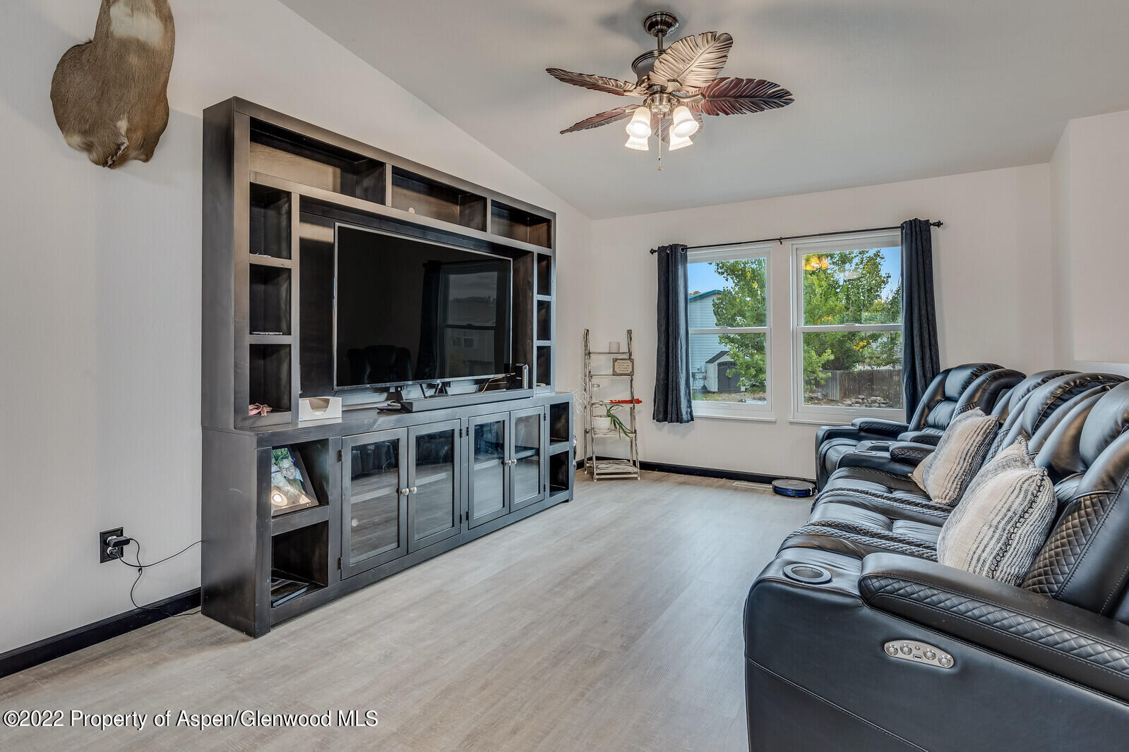 2447 Meadow Circle Rifle, CO 81650 - Photo 4 of 36 a living room with furniture and a flat screen tv