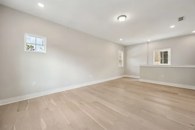 a bathroom with a granite countertop toilet a sink and bathtub